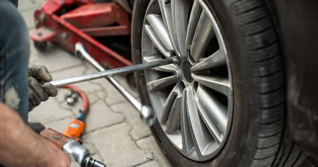 change a flat tire with proper tools